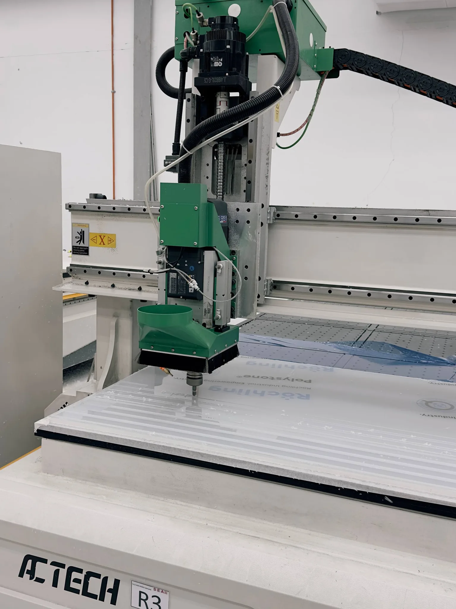 CNC router machining a workpiece