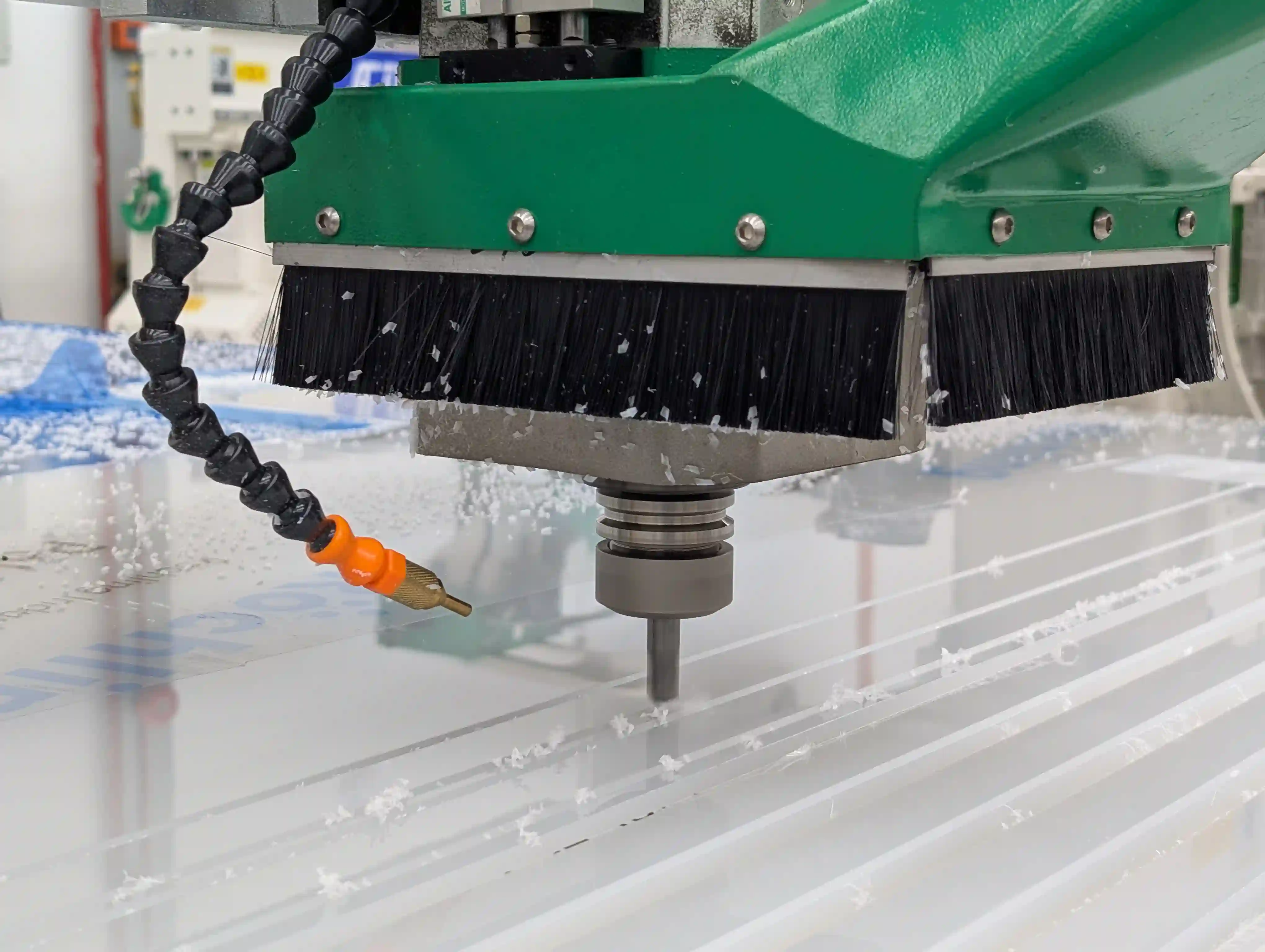 Close-up of a CNC router spindle cutting material